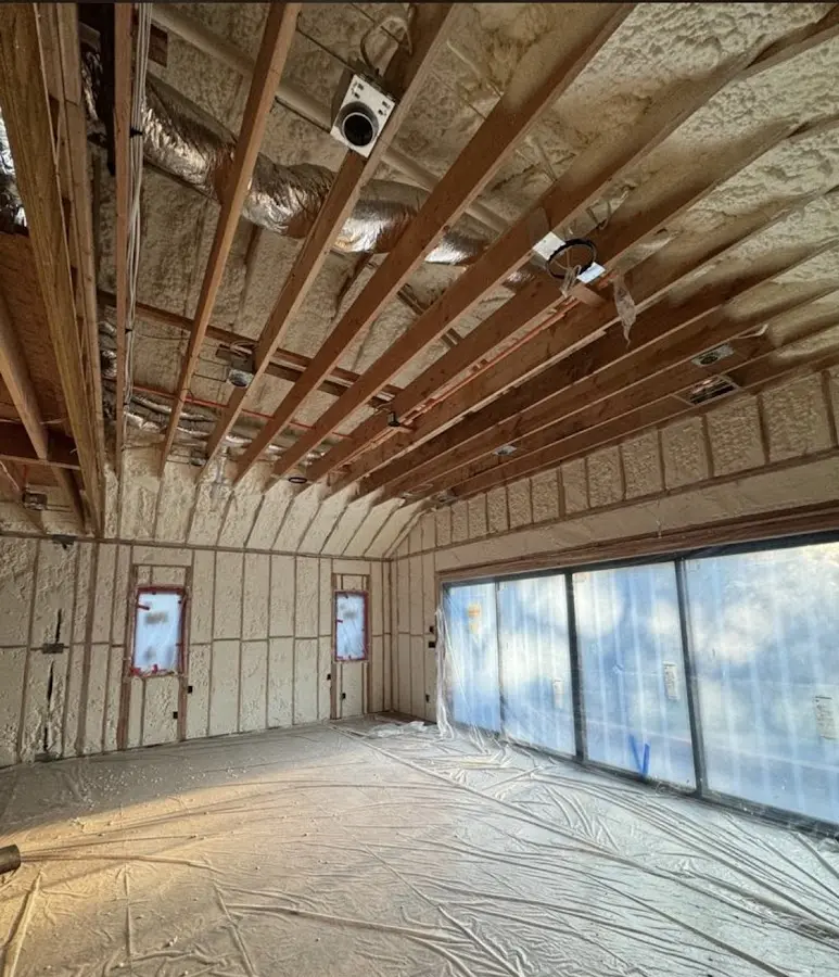 Interior walls and ceiling insulated with spray foam during new construction in Tega Cay